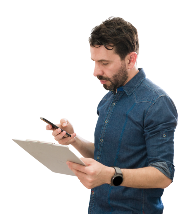 Photo of a professionally dressed man holding a clipboard in one hand and a mobile device in the other to indicate that non-technical buyers need a business broker who has a technical due diligence checklist.